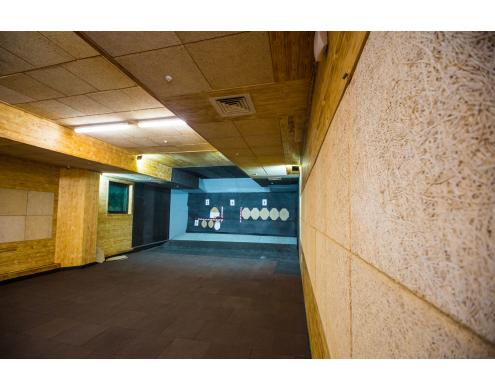 Ceiling and wall acoustic treatment in the shooting club